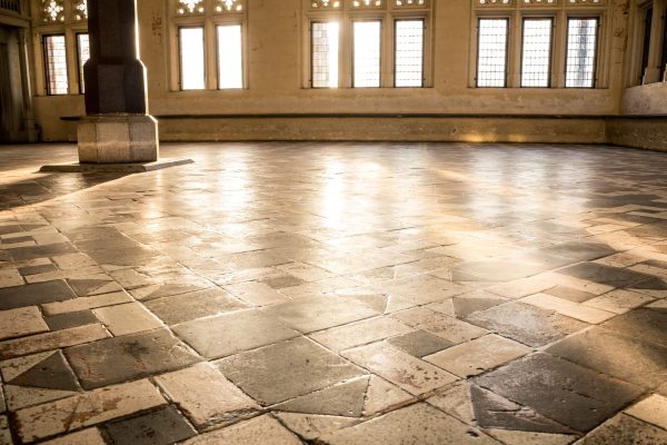 A closeup shot of a church interior with ceramic floor